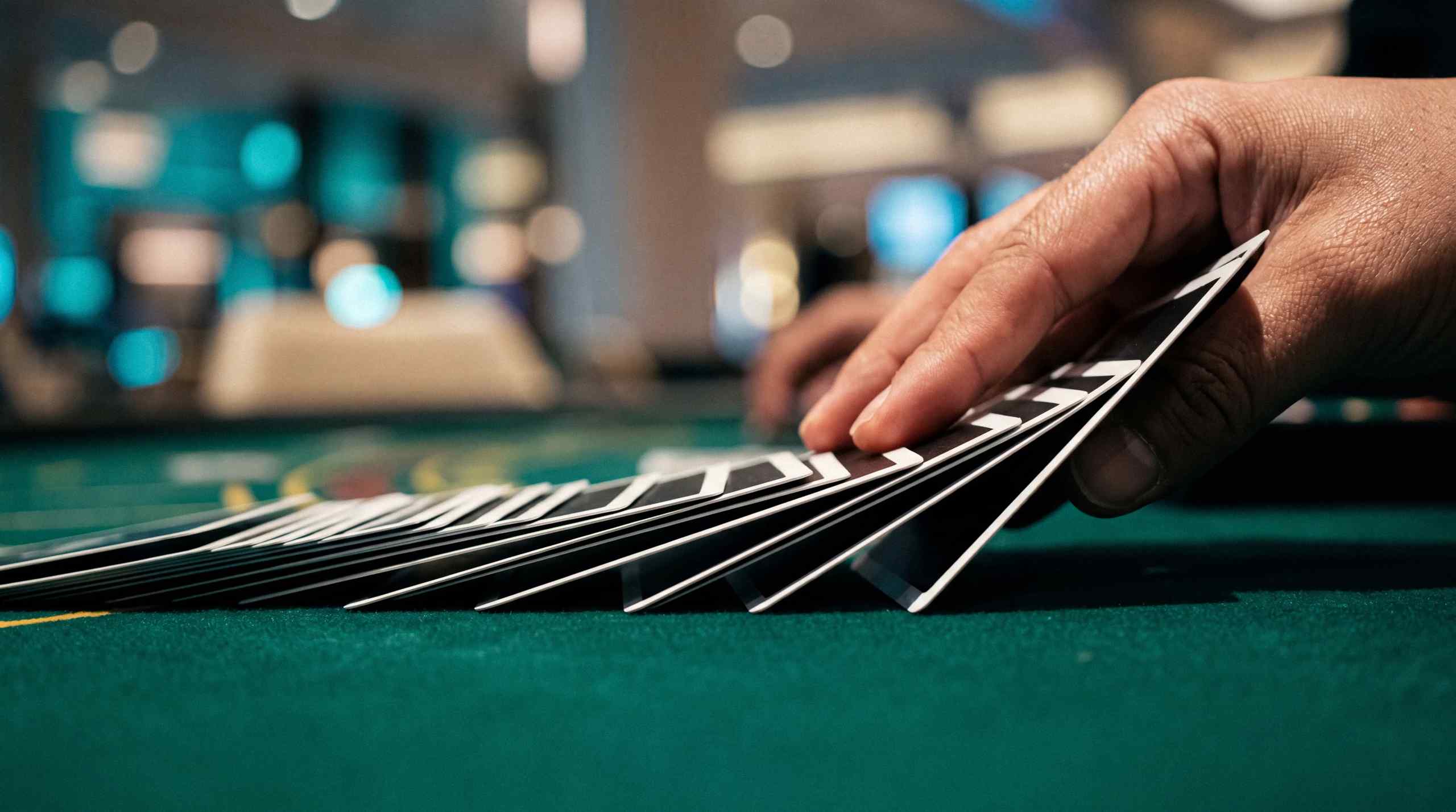 Modern playing cards being fanned out at a casino.